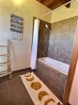 King bedroom ensuite bathroom slate enclosure with jetted tub